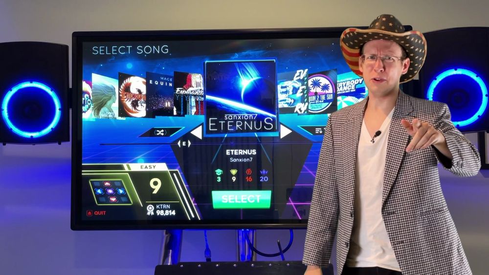 Me in an American flag cowboy hat standing off to the side of Eternus, on StepManiaX