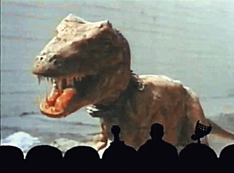 MST3K experiment 1004, Future War. A very large and frightening dinosaur that's totally not a forced perspective puppet wears a collar.