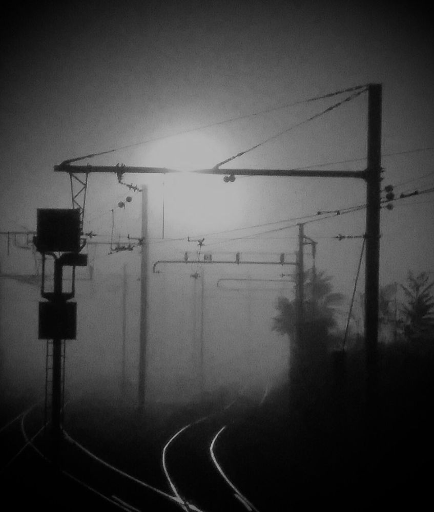 Frozen, foggy morning looking down the railway tracks in Langon, SW France