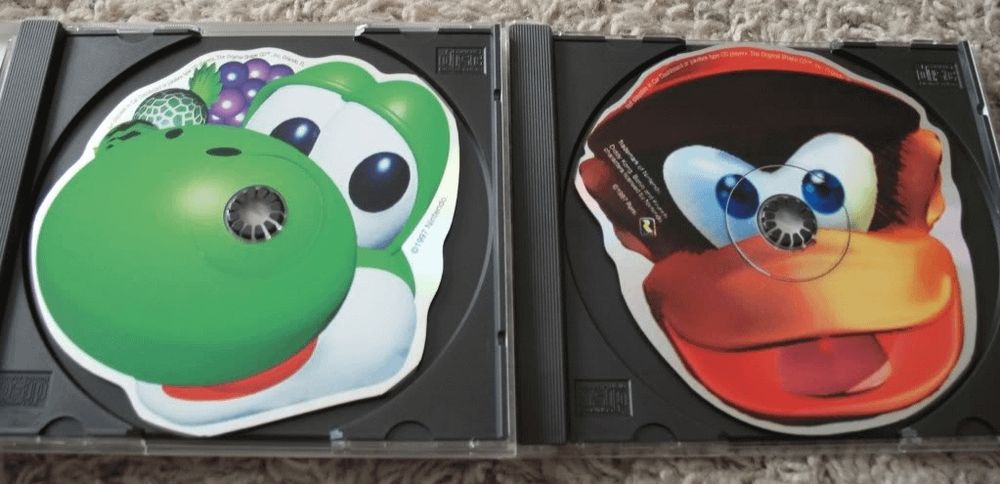 Strangely shaped CDs for Diddy Kong Racing and Yoshi's Story OST