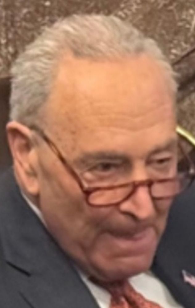 Chuck Schumer making a face like he's thinking about thos Beans