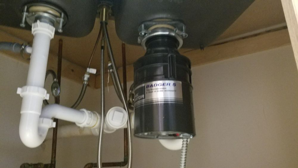 Original sink's plumbing. Quite simple. Nothing but a garbage disposal, from when we first purchased our home, 15 years later.  