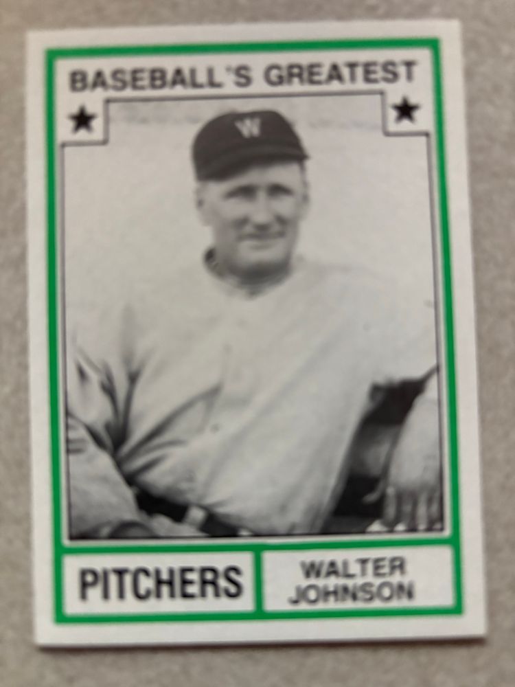 Walter Johnson Baseball’s Greatest Pitchers card. The Big Train appears to be relaxed while sitting. He wears a dark cap with a “W”.  