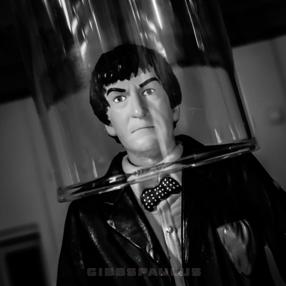 Doctor Who is strapped to an appratus, battling the Master of the Land Of Fiction.