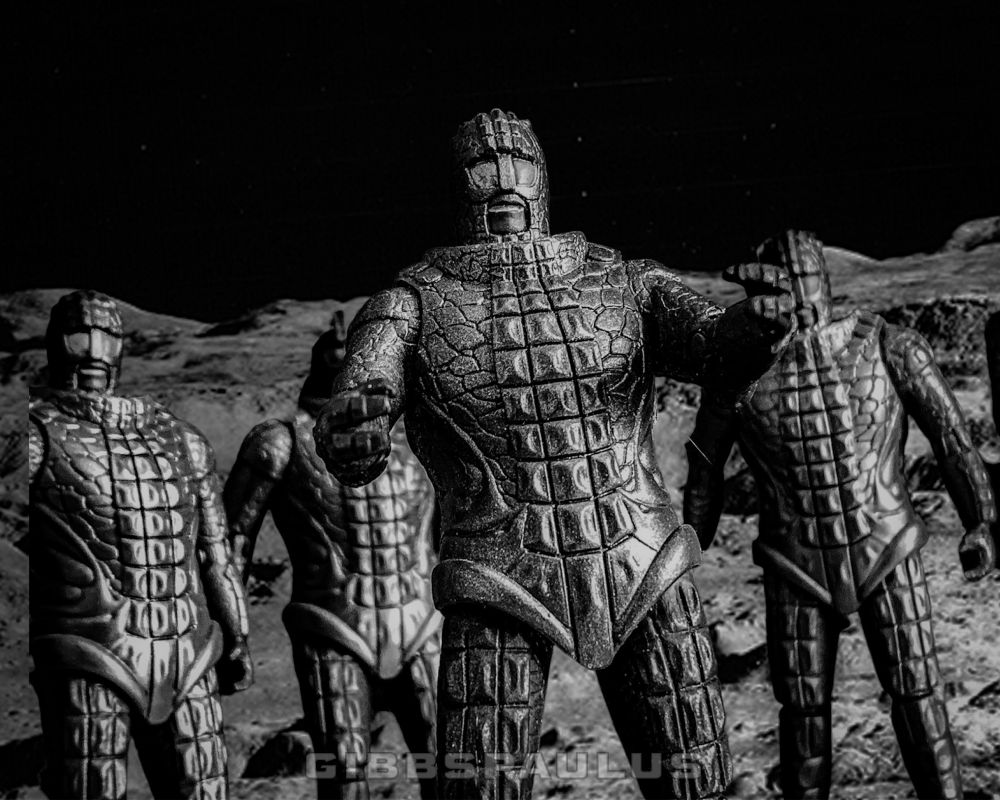 7ft tall, green, reptilian aliens march across the empty, grey surface of the moon.

Doctor Who
Ice Warriors