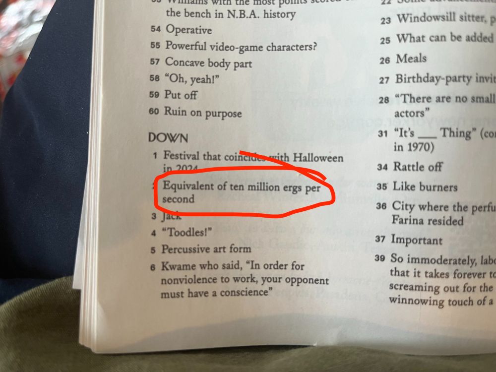 Clues to a crossword puzzle with "Equivalent of ten million ergs per second" circled.