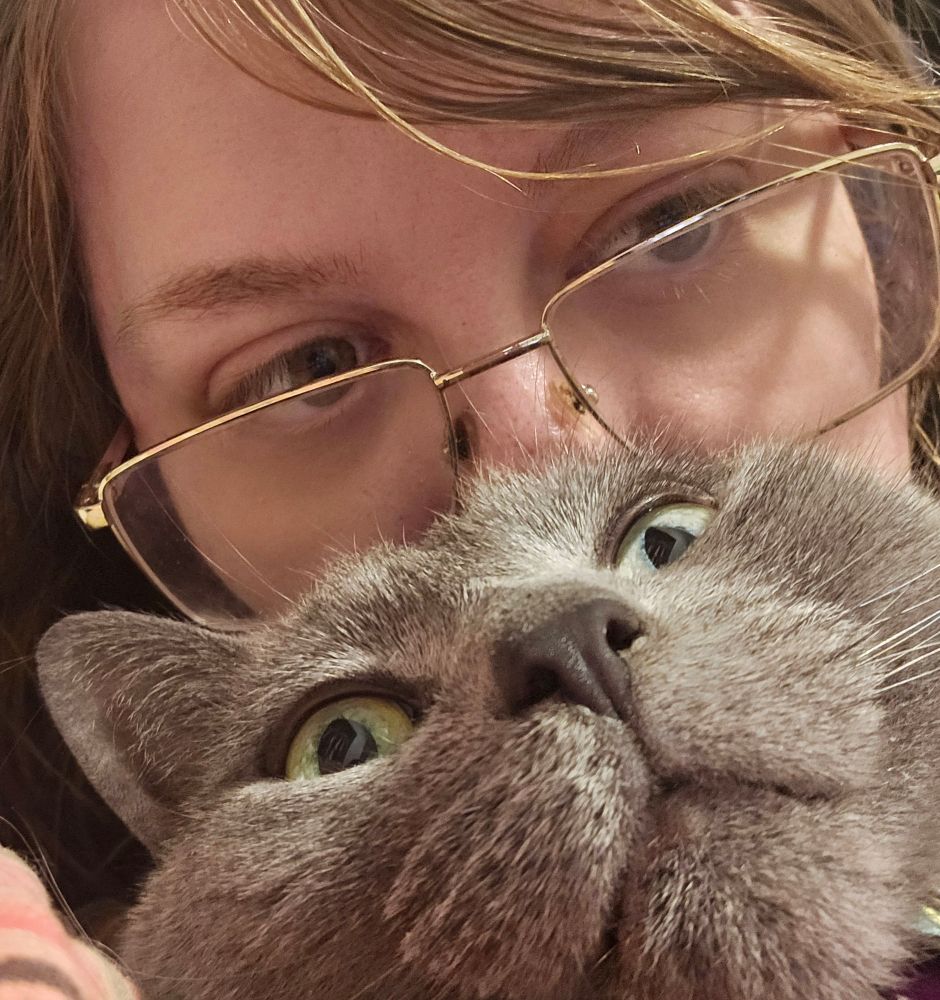 Myself and a little grey cat crammed into a selfy