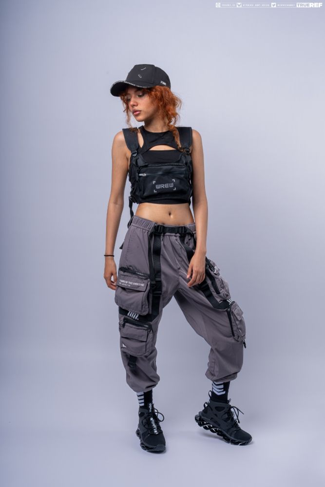 art pose reference of a woman in riot gear standing. 