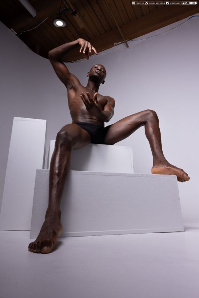 Pose references of a man sitting while making magical gestures with his hands. 
