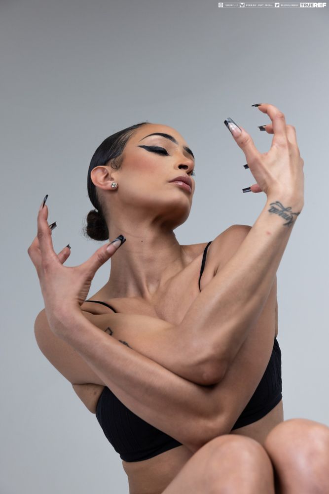 Pose reference of a women with long nails in an elegant gesture. 