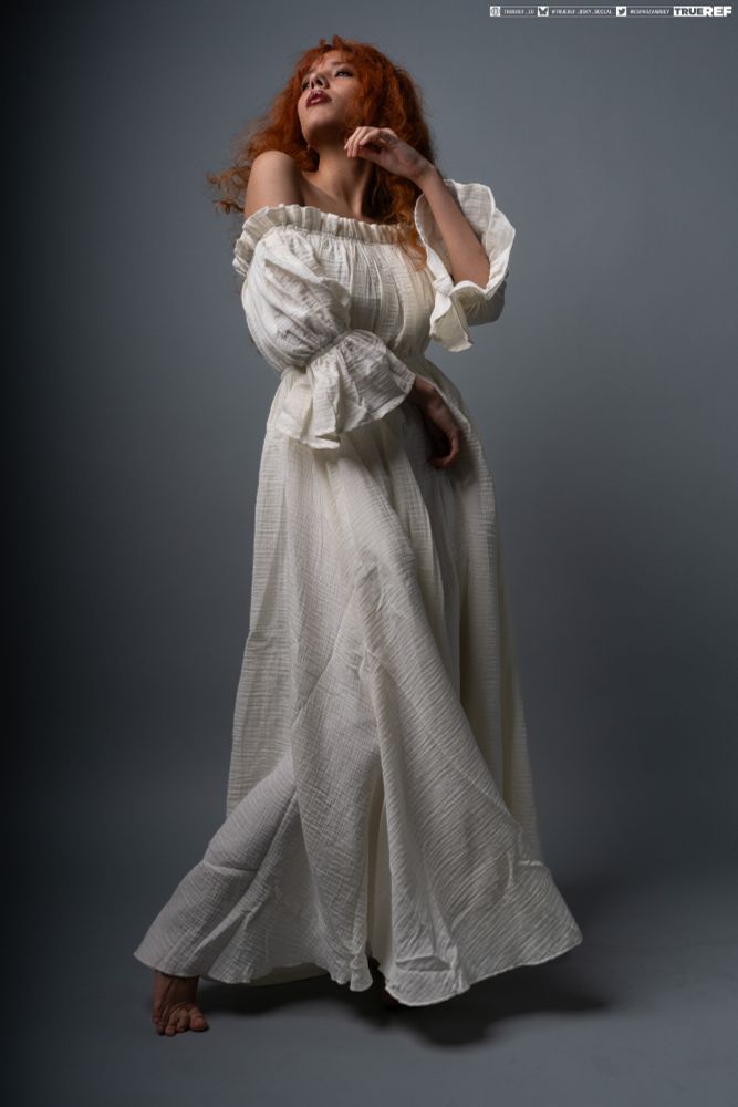 art reference of a woman in a white dress, standing. 