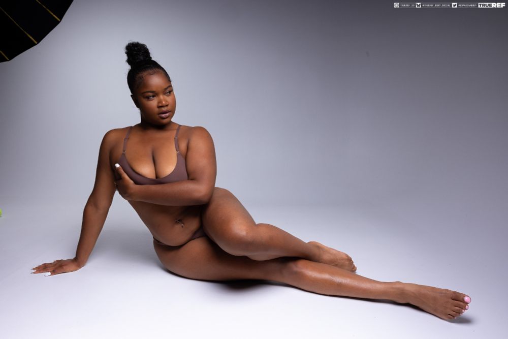 art pose reference of a woman laying on the floor.