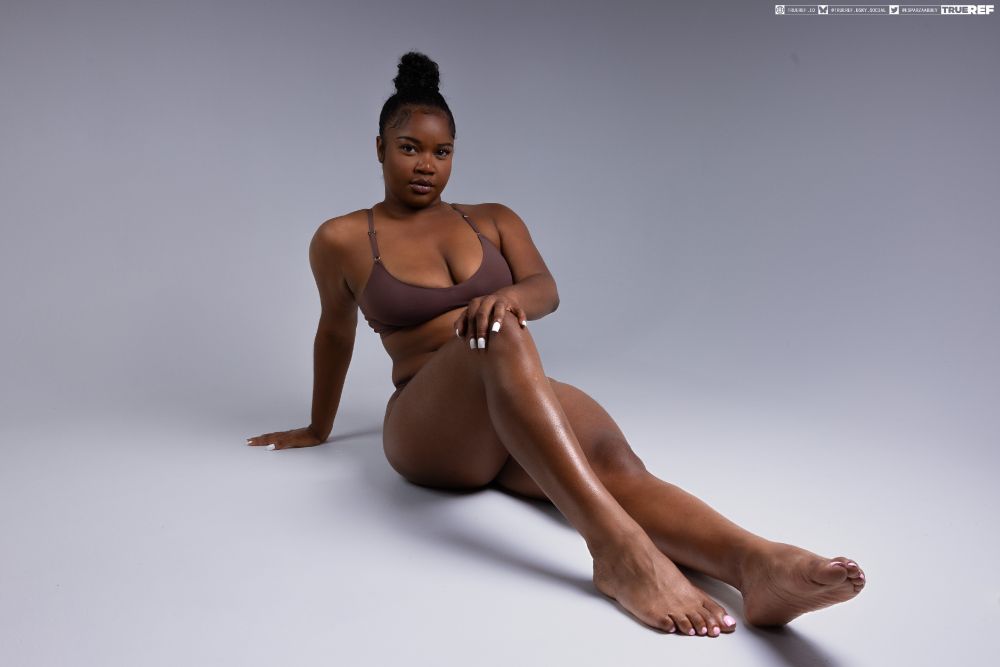 art pose reference of a woman laying on the floor.