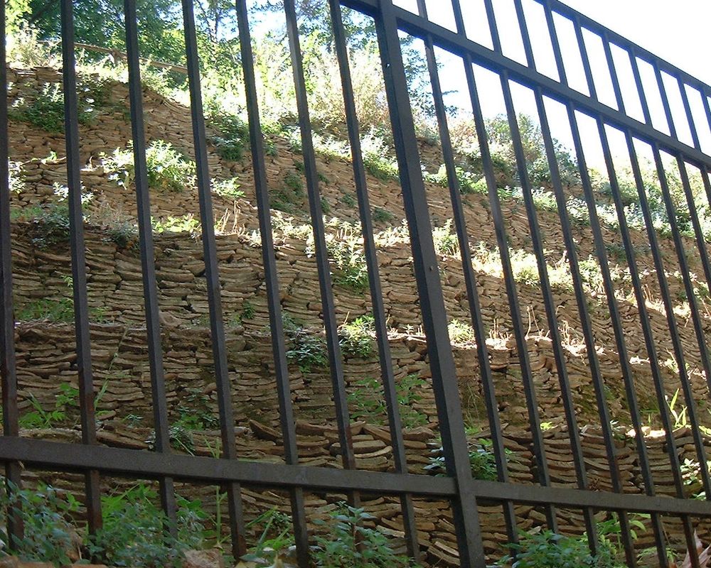 Layers of bits of broken amphorae built up on one another