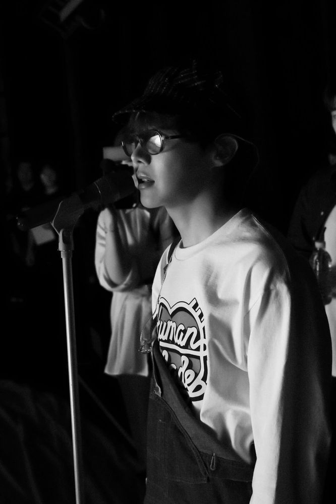 Hobi rehearsing in his denim jumper and white LS top. 