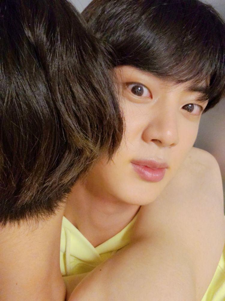 Shirtless Jungkook with his triangle gimbap hair hugging Jin