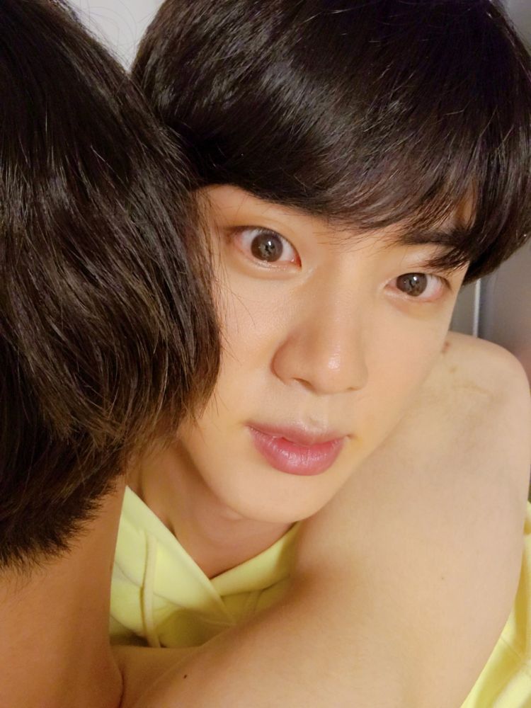 Shirtless Jungkook with his triangle gimbap hair hugging Jin