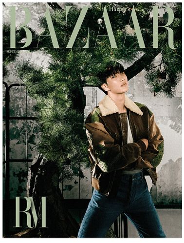 Namjoon under what looks like a giant bonsai????