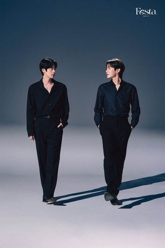 Seokjin and Hoseok in black slacks and dress shirt, walking and looking at each other