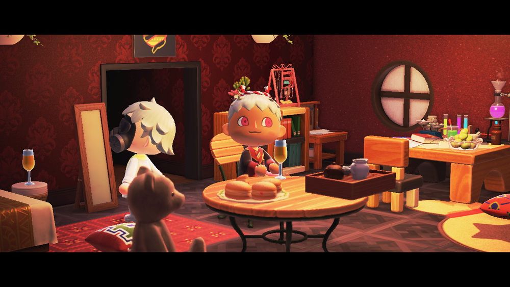 Animal Crossing New Horizons.
My ‘mayor’ is dressed up as Clear, from DRAMAtical Murder. Umi’s ‘mayor’ is dressed as a New Year’s Variant of Kalim, from Disney’s Mobile Game: Twisted Wonderland.
My ‘mayor’ is in front of a mirror, as I adjust my look.
Umi’s ‘mayor’ is sitting at a table, facing the camera, looking lovely.