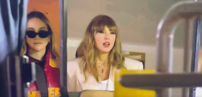 taylor swift at the superbowl wearing a white suit