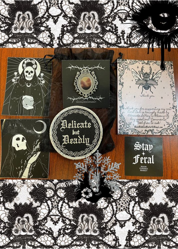 Collection of gothic pins and patches on a background of lace - stay feral