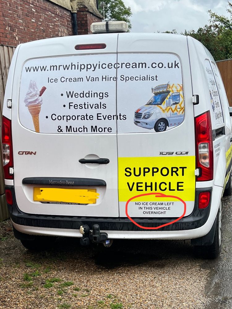 White van labelled as a Mr Whippy support vehicle. With a notice saying ‘no ice cream left in vehicle overnight’.