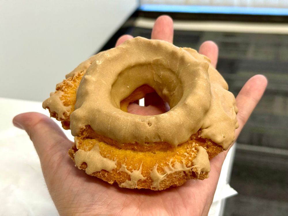 The donut in my hand. It more than covers my entire palm. 