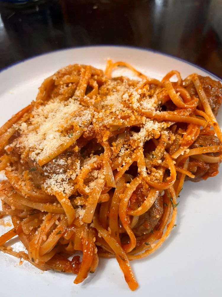 Spaghetti meatballs with parmesan sprinkled on top
