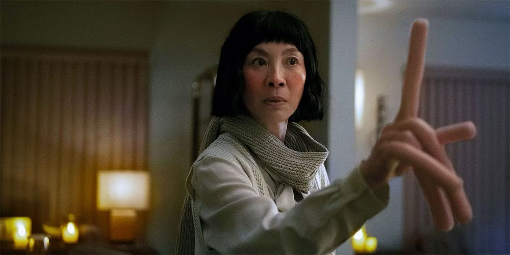 Michelle Yeoh in Everything, Everywhere, all at once. She has long, floppy fingers.  