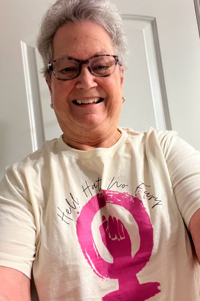Picture of me wearing a tee shirt that reads: Hell Hath No Fury above a women’s liberation symbol