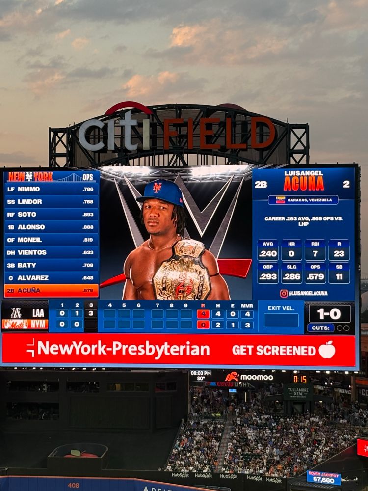 Luisangel Acuña on the Mets scoreboard in a WWE-themed outfit