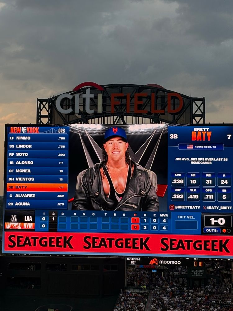 Brett Baty on the Mets scoreboard in a WWE-themed outfit