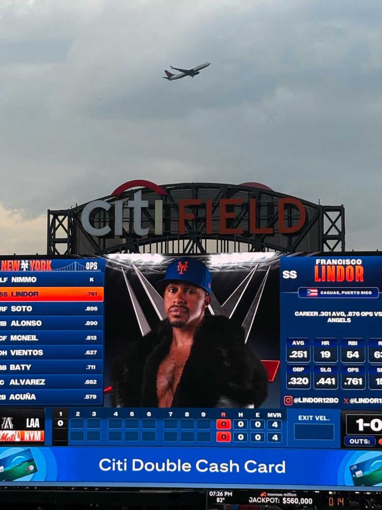 Francisco Lindor on the Mets scoreboard in a WWE-themed outfit
