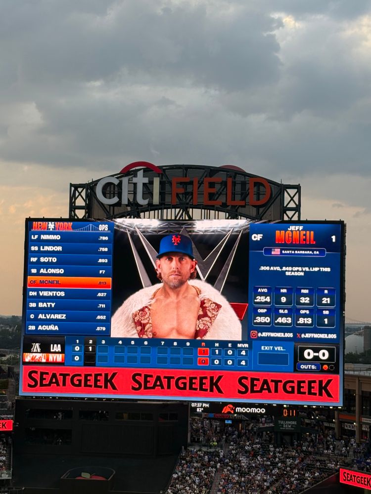 Jeff McNeil on the Mets scoreboard in a WWE-themed outfit