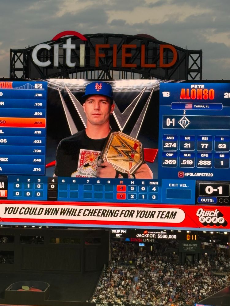 Pete Alonso on the Mets scoreboard in a WWE-themed outfit