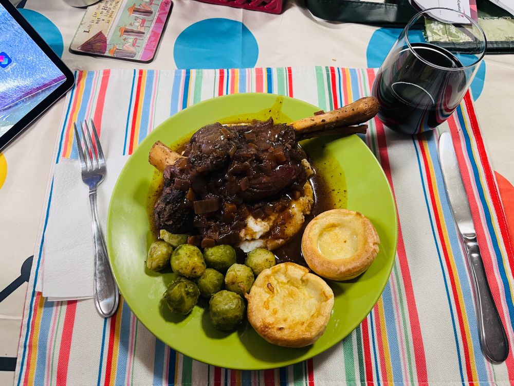 Comfort food on a chilly Thursday night. Lamb shank, mash, sprouts, Yorkies, Cabernet reduction. The unreduced Cabernet is in my glass.  😁