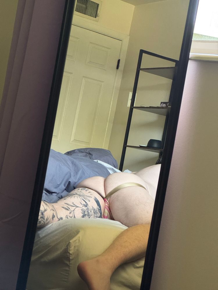 Mirror pic of my laying on my stomach in bed in a jock. Pic is level with my ass