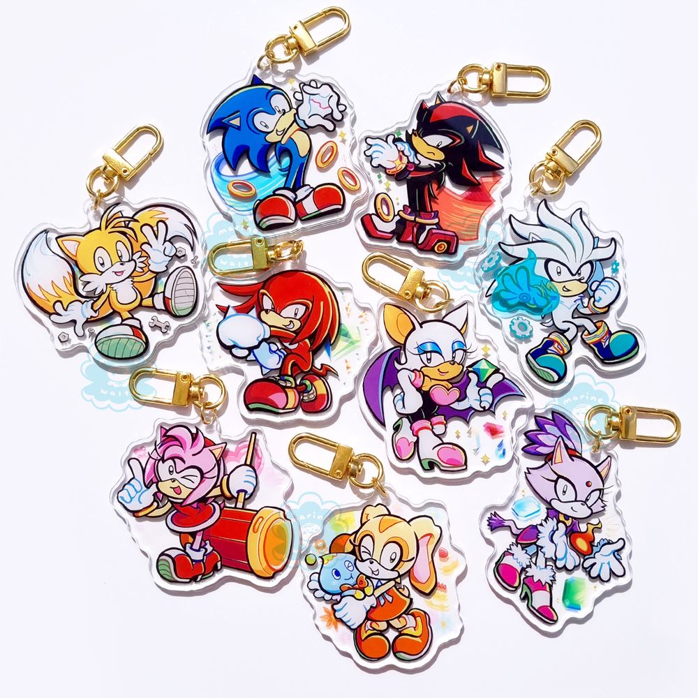 Photograph of Sonic the Hedgehog acrylic charms designed by marinewaltz. Characters include: Sonic, Shadow, Tails, Knuckles, Rouge, Silver, Amy, Cream, Blaze.