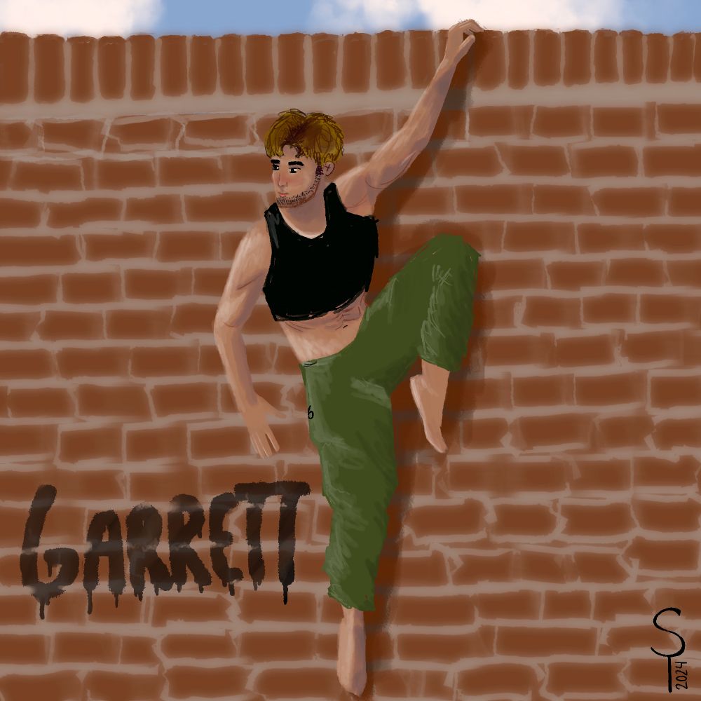 a young man hanging off a brick wall by 1 hand. He is wearing olive green track pants and a black crop top 