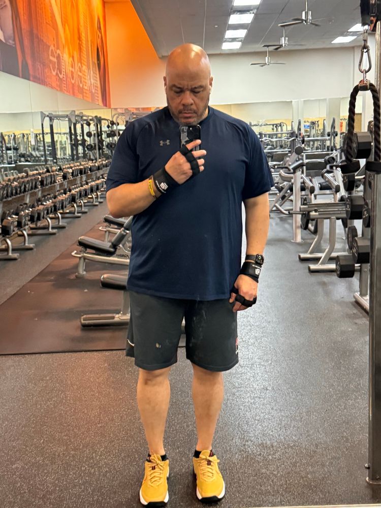 Old man standing in front of a mirror questioning his life choices. 