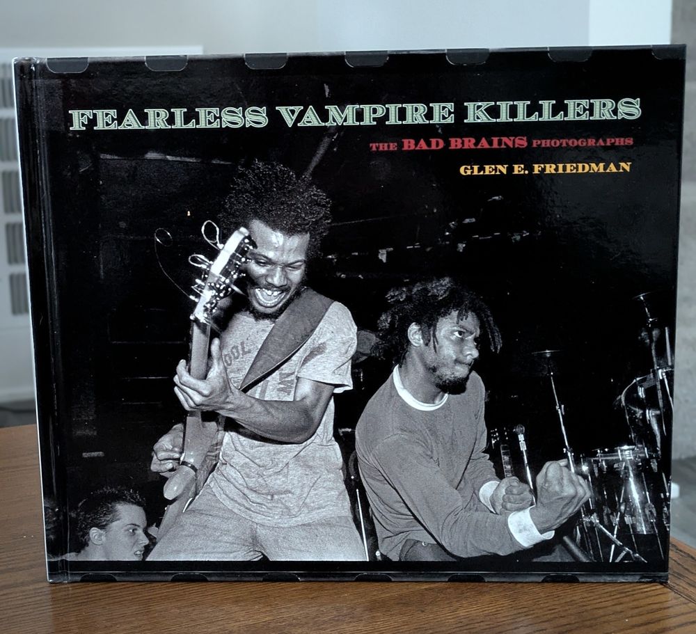 Cover of the book "Fearless Vampire Killers: The Bad Brains Photographs" by Glen E. Friedman, featuring a black-and-white photo of band members performing on stage.