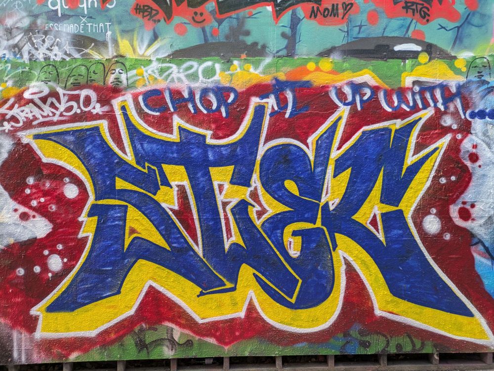 Blue/yellow/red stylized text graffiti
