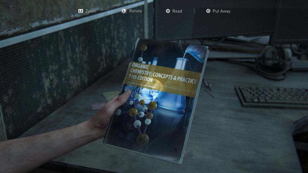 Ellie holding a book named “Organic Chemistry: Concepts & Practice 11th Edition”.