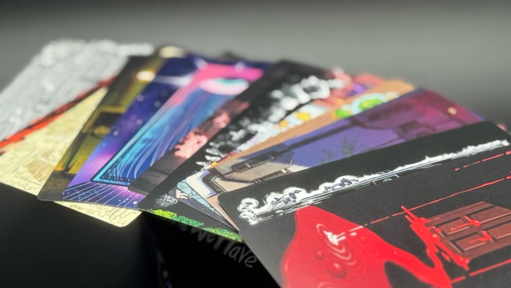 A detail shot of the Door Cards from The Time We Have fanned out