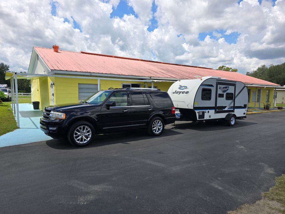 Ford Expedition hooked up to a Jayco Hummingbird Travel Trailer.