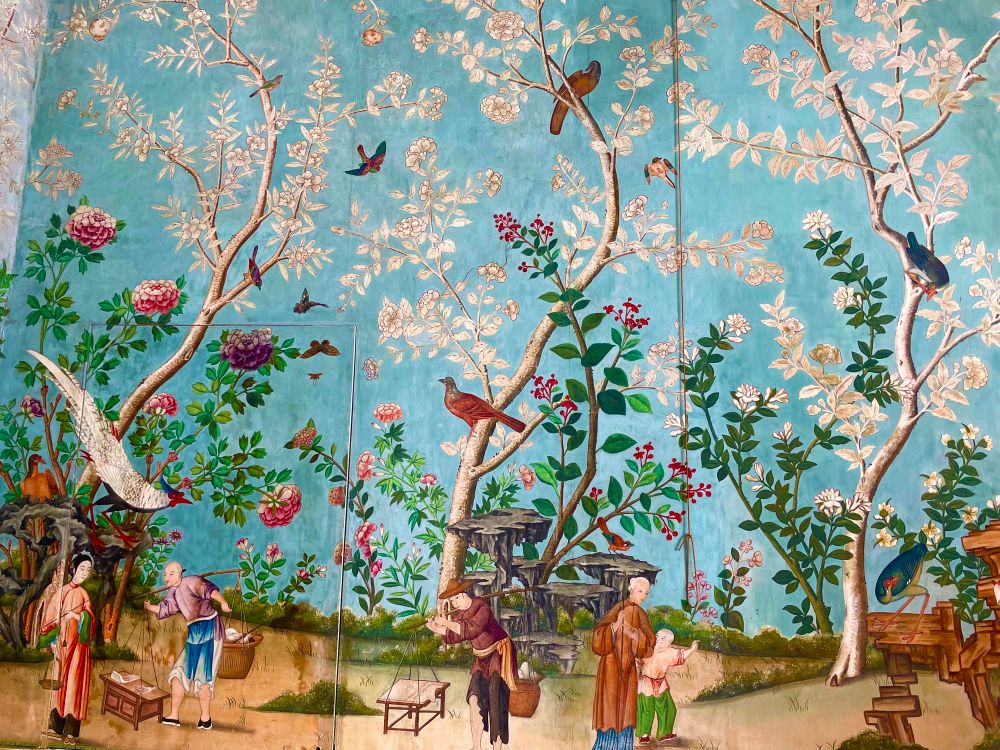 Chinese, hand made of several layers of mulberry fibres, wallpaper dating from the 17th century depicting scenes of contemporary Chinese life. People walking and carrying, showing trees and colourful birds