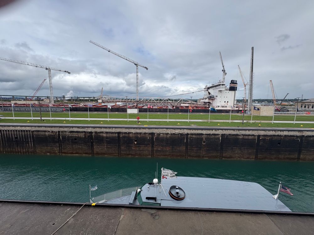 A huge freighter - the American Century 997 ft - going through the Soo Locks, heading for Lake Superior 