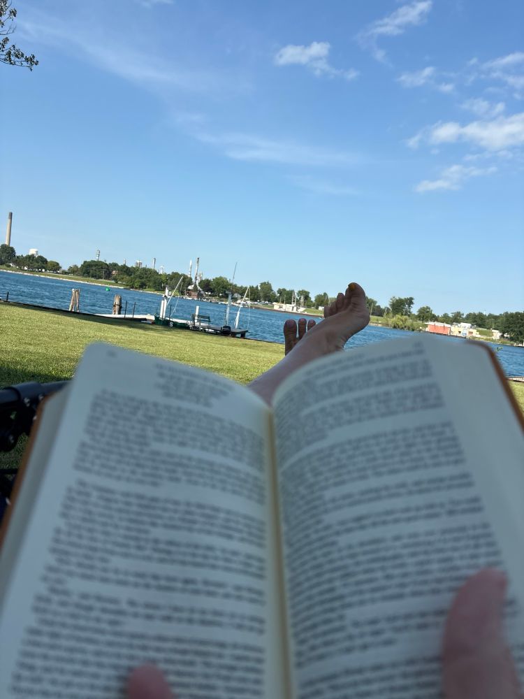 Re-reading Fellowship of the Ring, looking out at a glorious blue sky, bright green lawn and the St Clair River from a cottage on the NE portion of Stag Island in the St Clair River 
