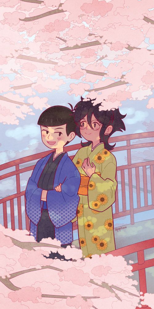 Aly is holding onto Karamatsu's arm as they walk side by side. They are on a red bridge that is over a body of water, framed by branches of sakura flowers. Karamatsu is wearing a simple blue kimono and Aly is wearing a light green kimono with a sunflower pattern